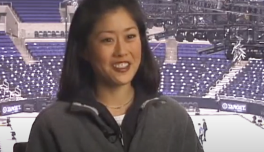 Kristi Yamaguchi with icerink behind her